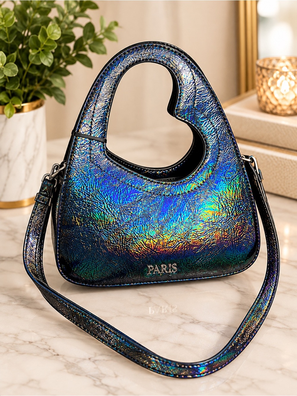 Iridescent Paris Hilton heartbreaker handle bag.